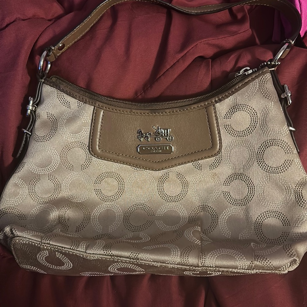 Old schoolish coach purse. Used w once or twice.